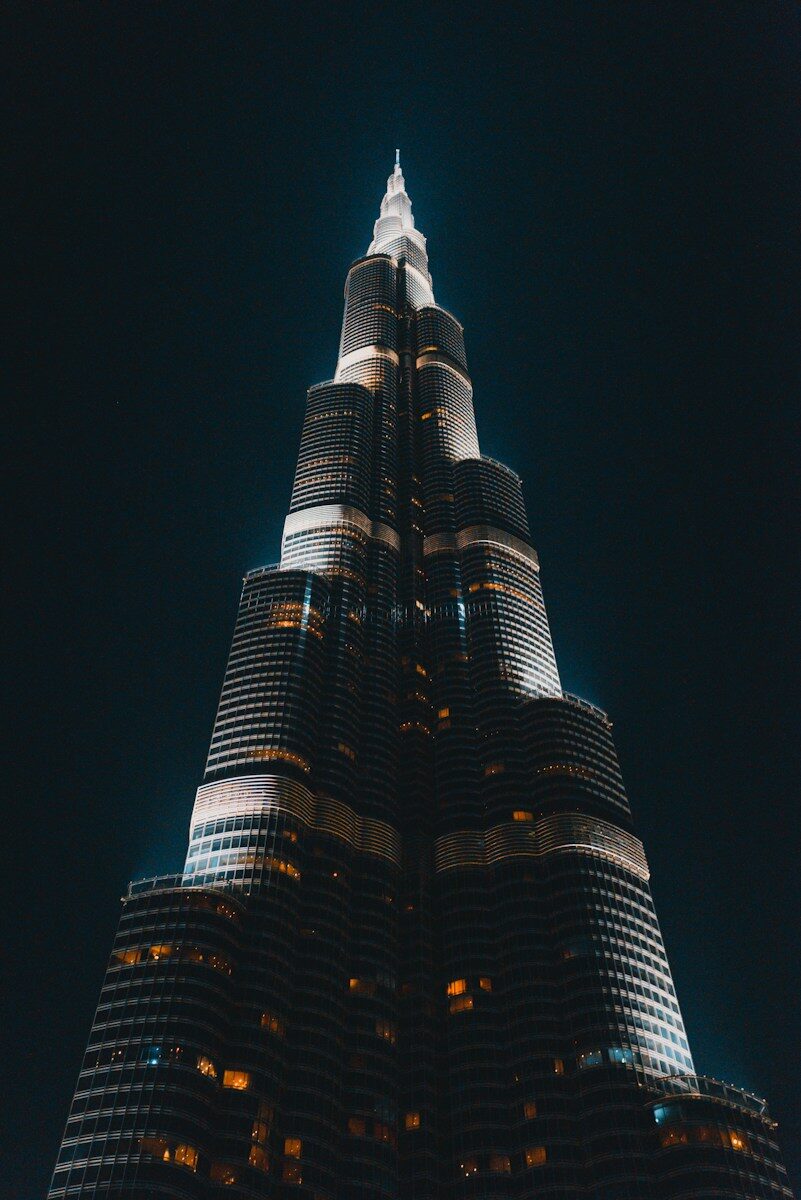 The Burj Khalifa skyscraper illuminated against a dark night sky in Dubai